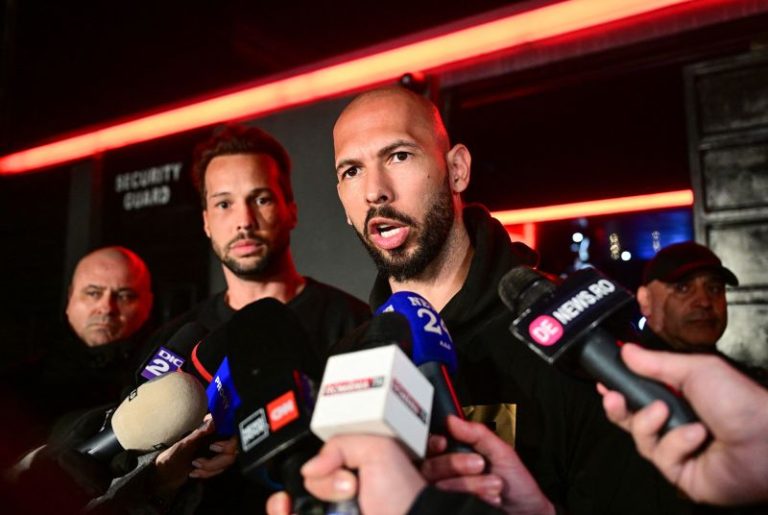 Self-proclaimed misogynist Andrew Tate and his brother appear at police station in Romania